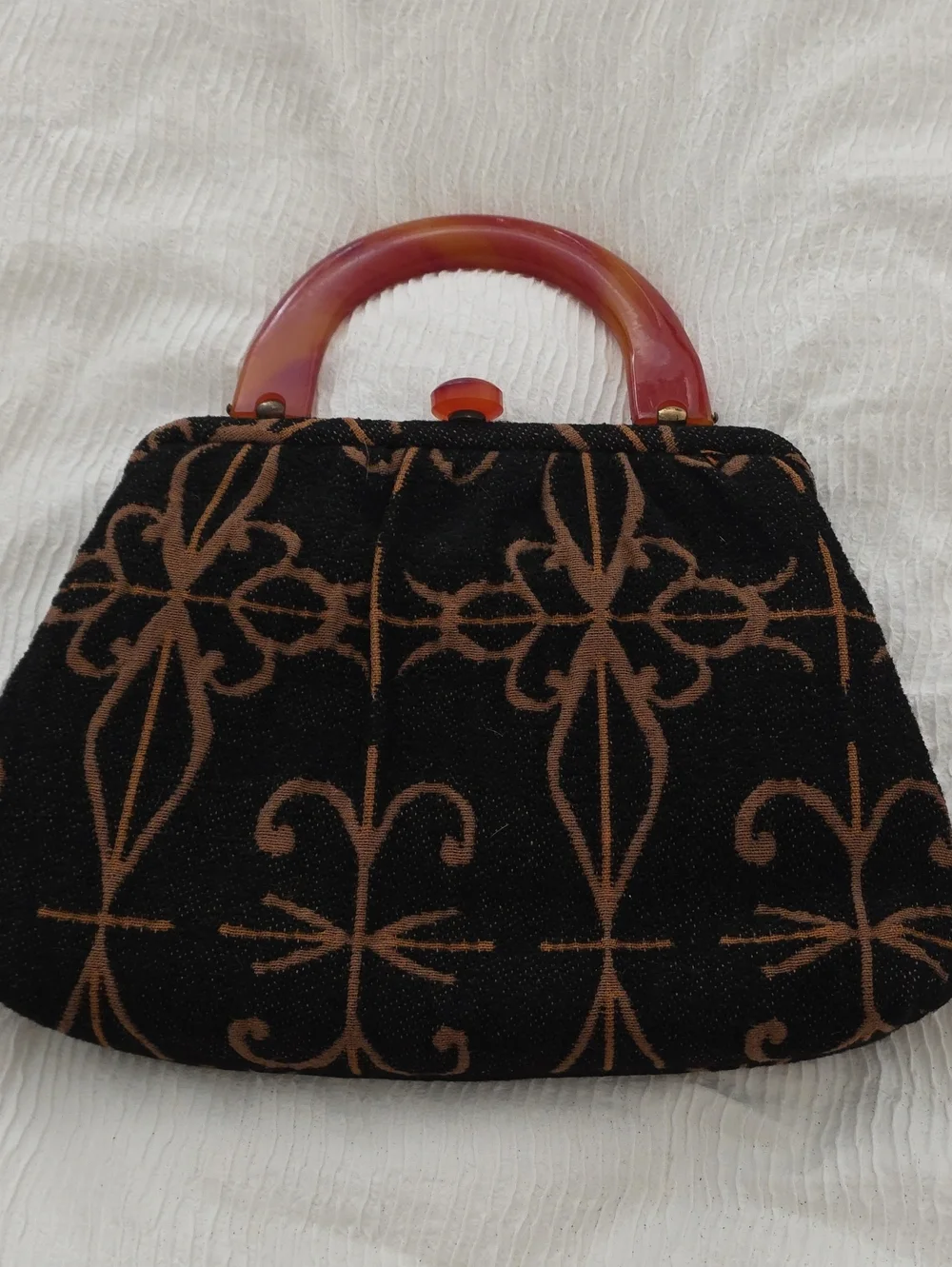 Black and Brown Patterned Wristlet Clutch with Amber Handle